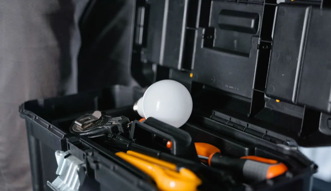 An open tool case with hand tools laid out ready for a service call